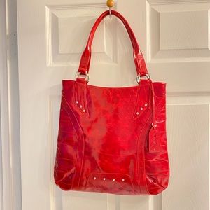 P. Sherrod of red leather bag.